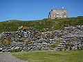 Tintagel - Dyntagel Castle ruins with Hotel.jpg