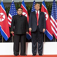 Trump and Kim standing next to each other