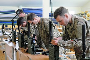Students practice configuring their radios prior to communications exam during Phase 2 of RSLC US Army RSLC-radio training.jpg