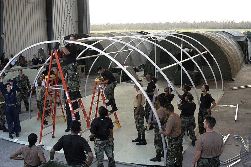 File:US Navy 050905-N-8154G-103 U.S. Navy personnel assigned to Casualty Receiving and Treatment Ship Team Eight (CRTS-8), based out of Naval Hospital Jacksonville, Florida, assist Army and Air Force Reservists as they set up a fiel.jpg