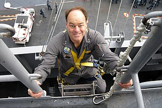 Christenson climbs a ladder in October 2010 to inspect the mast of the aircraft carrier USS Carl Vinson (CVN-70). US Navy 101020-N-6000H-021 Rear Adm. John N. Christenson, president of the Naval Board of Inspection and Survey (INSURV), climbs a ladder well to i.jpg