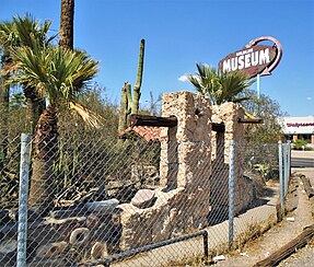 Part of the Cactus Garden, nd the sign advertising the "Wildlife Museum", which was a large display of taxidermy specimens stuffed by Ted Sliger, one of the owners of the resort. (2021) 2021 Buckhorn Baths Motel 06 Cactus Garden and Wildlife Museum sign.jpg