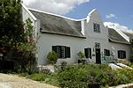 This house was built in about 1820 by a Mr De Lange and is the only H-shaped gabled house in the restored Church Street in Tulbagh. Type of site: House Previous use: Residential. Current use: House. 24 Church Street 01.jpg