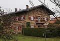 Am Ring 8; ehem. Forsthaus, zweigeschossiger Flachsatteldachbau mit unverputztem Bruchsteinmauerwerk und Stockwerksgesims, Fenstereinfassungen in Backstein, 1843. This is a picture of the Bavarian Baudenkmal (cultural heritage monument) with the ID D-1-87-156-2 (Wikidata)