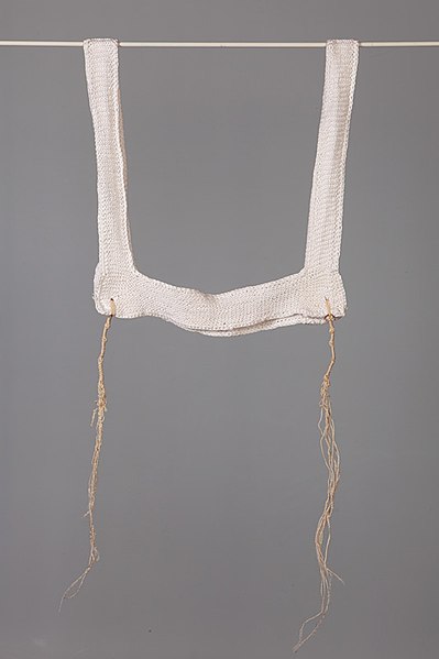 Knitted arba kanfot with worn tzitzit (2 of 4), Basel, 1930s, in the collection of the Jewish Museum of Switzerland.