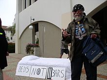 The "Beds Not Bars" slogan suggests that society must help homeless people instead of outlawing their behavior. BedsNotJails.jpg