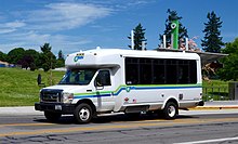 A minibus in "C-Van" paratransit service C-Van paratransit van of C-Tran in older paint scheme (2017).jpg