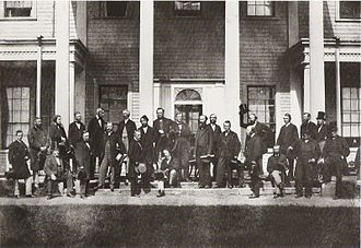 Members of the Charlottetown Conference, a conference to discuss Canadian Confederation, in front of Government House in 1864. Charlottetown Conference Delegates, September 1864.JPG