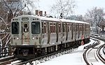 A Brown Line train arriving at Belmont in March 2009