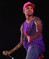 The media criticized Rihanna's decision to collaborate with Chris Brown following their 2009 domestic violence case. Chris Brown 5, 2012.jpg