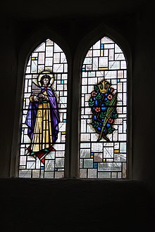 Memorial stained glass window in the Church of St Peter, Marksbury to a resident who lost her life when the Pensford Bridge was swept away.