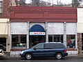 This is the only visible portion of this original building dating from 1893. It shares a wall with 122 S Main at left.