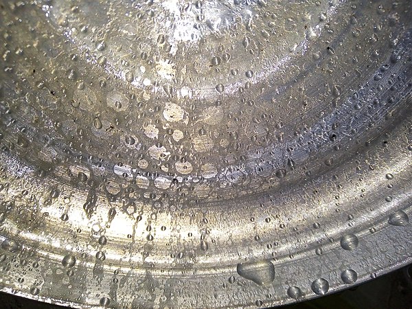 Droplets of water vapor in a pan.
