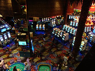 Overhead view of a casino floor with table games (bottom) and slot machines DSC29095, Atlantis Casino Hotel, Reno, Nevada, USA (5477998844).jpg