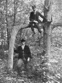 Photographer H.B. Welch (left) and J. Walter Bassett pose with Door Tree c. 1898 Door Tree 1898.png