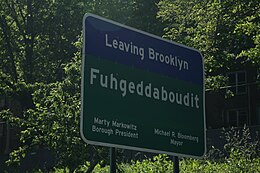 A sign on the periphery of Brooklyn that reads "Fuhgeddaboudit" (a pronunciation spelling of "forget about it"), illustrating the "Brooklyn accent"'s non-rhoticity and t-voicing Fuhgeddaboudit.jpg