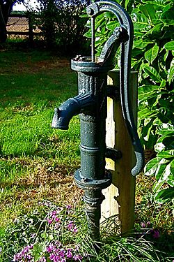 An old hand pump in a garden, Norfolk, UK