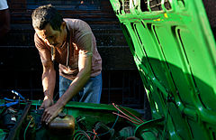 Street life: a man fixing a car. Havana (La Habana), Cuba