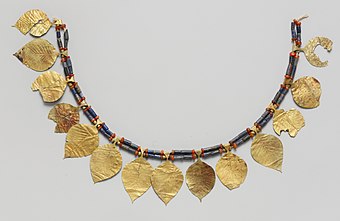 Headdress; 2600-2500 BC; gold (the leaves), lapis lazuli (the blue beads) and carnelian (the orange beads); length: 38.5 cm; Metropolitan Museum of Art