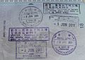 Entry and exit stamps issued at Hong Kong International Airport and the Hong Kong–Macau Ferry Terminal in an Italian passport