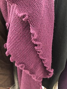 A knit shawl featuring a lettuce hem. Knit shawl lettuce hem.jpg