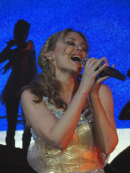 Minogue performing the song on her Aphrodite: Les Folies Tour (2011).