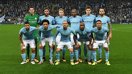 Manchester City players before a UEFA Champions League match in 2017. (Top row, left to right: Ederson, Walker, De Bruyne, Fernandinho, Stones, Nicolás Otamendi. Bottom row, left to right: Agüero, Leroy Sané, David Silva, Fabian Delph, Jesus. Only Ederson,  Walker, Stones and De Bruyne currently remain at the club.