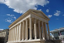 The Maison Carree was a temple of the Gallo-Roman city of Nemausus (present-day Nimes) and is one of the best-preserved vestiges of the Roman Empire. Maison Carree 2.jpg