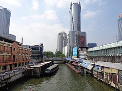 Pratunam Pier seen from the western side Major ferry boat stop Bangkok with skyscraper.JPG