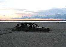 Abandoned car in Morecambe Bay, 1,300 ft (400 m) from the shore Morecambe Bay, abandoned car.jpg