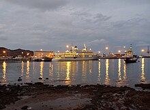 The Oman Royal Yacht Squadron moorings at Mina Qaboos at dusk Mutrah (1).jpg