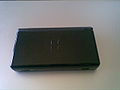 An onyx Nintendo DS Lite closed.