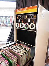 An open PDP-8/E with its logic modules behind the front panel and one dual TU56 DECtape drive at the top PDP-8e, inside, 2.jpg