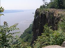 Trap rock cliff overlooking the Hudson River from an overlook on the Hudson Palisades in Bergen County, New Jersey, U.S. Palisades Sill near Englewood Cliffs.jpg