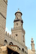 The minaret of Sultan Qalawun's complex, originally built in 1285. The third level was rebuilt in brick by his son in 1303. The conical cap is from Ottoman repairs centuries later.[68]