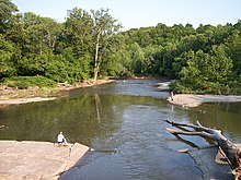 A bend in the Rocky River and adjoining riverbanks are seen in this photo taken from a bridge on the Cleveland-Rocky River border in the Rocky River Reservation. Rocky River Cleveland Ohio.jpg