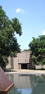 The Rothko Chapel with Barnett Newman's Broken Obelisk in the reflecting pond