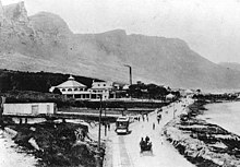 A view of the Rotunda on Victoria road in Camps Bay in 1905. The tramway to Sea Point and Cape Town is visible in the foreground. Rotunda , Victoria road, Camps Bay 1905.jpg