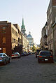 Another street in Old Montreal, looking towards the Marché Bonsecours. Rue Saint-Paul seen from the corner of rue Berri. In the distance is the dome of the Marché Bonsecours, with the spire of Notre-Dame de Bonsecours to its left.