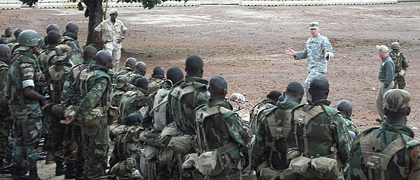 Maj. Gen. David R. Hogg (center), commander U.S. Army Africa inspects Sierra Leonean troops during a deployment ceremony on May 20, 2011.