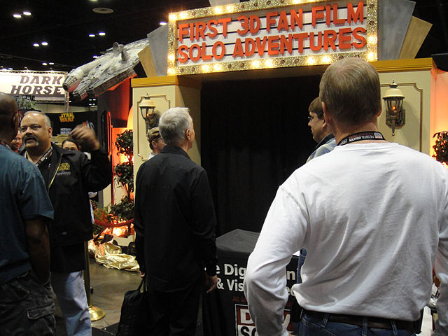 A booth screening a Star Wars fan film at a convention