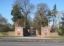 East Lodge gates, Sutton Place, on the north side of the A3 road.