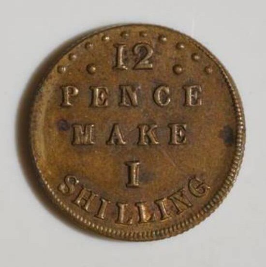 Toy coin, which teaches children the value of a shilling