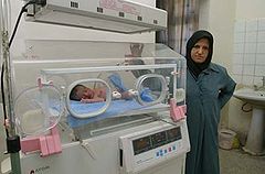 A nurse keeps an eye on a baby in the neonatal ward in Basrah