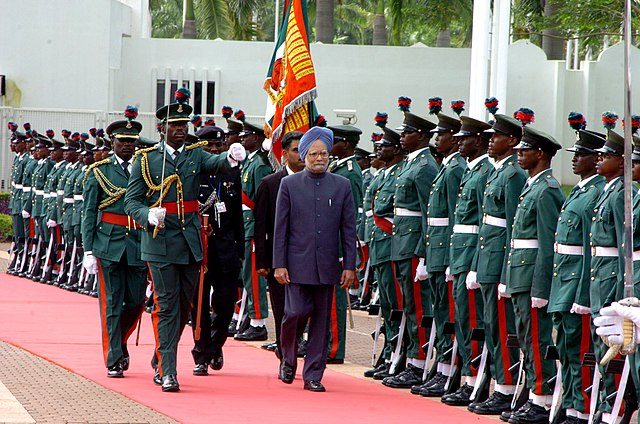 Indian Prime Minister Manmohan Singh inspecting the Presidential Guard Brigade during his visit to Abuja in October 2007.