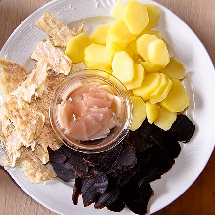 Traditional dish consisting of dried pilot whale meat (the black meat), blubber (in the center) which has been brined, cooked cold potatoes, and dried fish