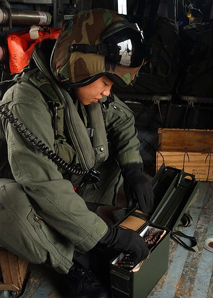 File:US Navy 050426-N-7512V-012 Aviation Warfare Systems Operator 3rd Class Mary Truong readies ammunition for the M240 machine gun in an HH-60H Seahawk helicopter.jpg