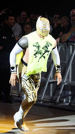 Arias as Sin Cara at a WWE Live event in 2015.