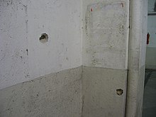 Bullet holes on the wall at the CSMT 2008 Mumbai terror attack VT bullet mark.jpg