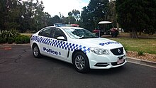 A Victoria Police vehicle with blue-and-white Sillitoe tartan 2014 Holden Commodore (VF MY14) Evoke sedan, Victoria Police (2015-01-02).jpg